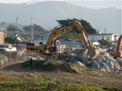 Backhoe on the rock pile